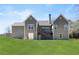 Exterior view of a home with a well-maintained backyard and wooden deck at 1656 Maes Overlook, Loganville, GA 30052