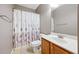 Bathroom featuring a vanity with sink and toilet, next to a bathtub with shower at 1656 Maes Overlook, Loganville, GA 30052