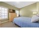 A comfortable bedroom with a bed, dresser, and natural light at 1656 Maes Overlook, Loganville, GA 30052