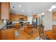 Features a kitchen island, stainless steel appliances, and hardwood floors at 1656 Maes Overlook, Loganville, GA 30052