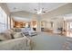 Spacious living area featuring an open layout with seamless transitions to the kitchen and dining areas at 1656 Maes Overlook, Loganville, GA 30052