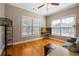 Cozy living room with hardwood floors, ample natural light, and modern decor at 1656 Maes Overlook, Loganville, GA 30052