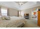 Bright main bedroom with a tray ceiling, neutral walls, and an ensuite bathroom at 1656 Maes Overlook, Loganville, GA 30052