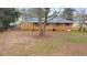 Spacious backyard featuring a brick house with many windows at 3783 Brookcrest Cir, Decatur, GA 30032