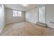Spacious basement with neutral carpet, large window providing natural light, and an entrance at 3783 Brookcrest Cir, Decatur, GA 30032