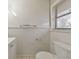 White bathroom featuring sink vanity, tile flooring, toilet and window with lots of light at 3783 Brookcrest Cir, Decatur, GA 30032
