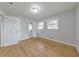 Sunlit bedroom with pristine hardwood floors, open doors, and ample natural light at 3783 Brookcrest Cir, Decatur, GA 30032