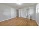 Hardwood bedroom featuring two doors, closet and window with views to the outside at 3783 Brookcrest Cir, Decatur, GA 30032