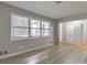 Spacious living room with modern gray walls and new floors at 3783 Brookcrest Cir, Decatur, GA 30032