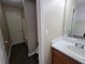 Cozy bathroom with a single sink vanity, toilet and a bathtub at 916 Hunt Rd, Jonesboro, GA 30236