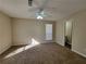 Comfortable bedroom with carpet, ceiling fan, neutral paint, and natural light at 916 Hunt Rd, Jonesboro, GA 30236