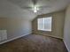 Well-lit bedroom with vaulted ceilings and a large window at 916 Hunt Rd, Jonesboro, GA 30236