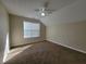 Bright bedroom with carpet, a ceiling fan, and window is ready to be furnished at 916 Hunt Rd, Jonesboro, GA 30236