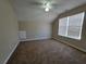 Bright bedroom with vaulted ceilings, ceiling fan and large window at 916 Hunt Rd, Jonesboro, GA 30236