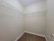 Walk-in closet features ample shelving for optimal storage and organization at 916 Hunt Rd, Jonesboro, GA 30236