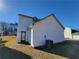 Exterior view of a house showcasing the back facade and a well-maintained lawn at 916 Hunt Rd, Jonesboro, GA 30236