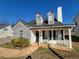 Charming home featuring a stone facade, black shutters, and inviting front porch at 916 Hunt Rd, Jonesboro, GA 30236