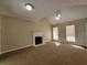 Inviting living room with a fireplace, ceiling fan, and bright windows at 916 Hunt Rd, Jonesboro, GA 30236