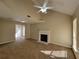 Spacious living room with fireplace, carpet, high ceilings, and natural light at 916 Hunt Rd, Jonesboro, GA 30236