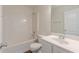 Well-lit bathroom features a shower-tub combo and a single sink vanity at 239 Gilliam Ct, Locust Grove, GA 30248