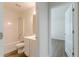 A clean bathroom leads to a bedroom with sleek, modern flooring at 239 Gilliam Ct, Locust Grove, GA 30248