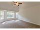 Cozy bedroom with large windows, plush carpet, and natural light at 239 Gilliam Ct, Locust Grove, GA 30248