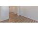 Bedroom with neutral paint, modern floors, and large doorway to another room at 239 Gilliam Ct, Locust Grove, GA 30248