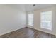 Bright bedroom with fresh paint, modern floors, and windows providing natural light at 239 Gilliam Ct, Locust Grove, GA 30248