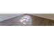 New laminate flooring is brightened by natural light from the window at 239 Gilliam Ct, Locust Grove, GA 30248