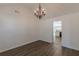 Dining room with chandelier, vaulted ceiling, and view into the kitchen at 239 Gilliam Ct, Locust Grove, GA 30248
