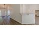 Inviting entryway with hardwood floors, granite breakfast bar, and plenty of natural light at 239 Gilliam Ct, Locust Grove, GA 30248