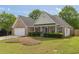 Charming single Gathering home with brick accents, manicured lawn, and a two-car garage at 239 Gilliam Ct, Locust Grove, GA 30248