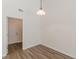 Bright hallway with wood flooring and view to front door at 239 Gilliam Ct, Locust Grove, GA 30248