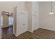 Hallway with view to dining room, and large closets for storage at 239 Gilliam Ct, Locust Grove, GA 30248
