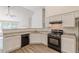 Kitchen with granite countertops, black appliances, and bar seating at 239 Gilliam Ct, Locust Grove, GA 30248