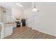 Well-lit kitchen with modern appliances, granite countertops, and ample cabinet space at 239 Gilliam Ct, Locust Grove, GA 30248