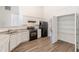 Bright kitchen with granite countertops, stainless appliances, pantry, and bar seating at 239 Gilliam Ct, Locust Grove, GA 30248