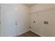 Clean, functional laundry room with storage space and modern fixtures at 239 Gilliam Ct, Locust Grove, GA 30248