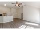 Open living area featuring hardwood floors, bright light and modern lighting fixtures at 239 Gilliam Ct, Locust Grove, GA 30248