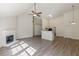 Spacious living area with fireplace, open kitchen, and plenty of natural light at 239 Gilliam Ct, Locust Grove, GA 30248
