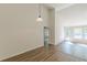 Bright living room with hardwood floors, high ceilings, and access to the backyard at 239 Gilliam Ct, Locust Grove, GA 30248