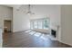 Bright and airy living room with hardwood floors, fireplace, and lots of natural light at 239 Gilliam Ct, Locust Grove, GA 30248
