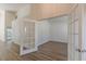 Bright office space with glass French doors and modern floors, with view to living area at 239 Gilliam Ct, Locust Grove, GA 30248