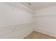 Bright walk-in closet features carpeted floors and wire shelving at 239 Gilliam Ct, Locust Grove, GA 30248
