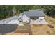 Aerial view of the backyard with a concrete patio and exterior stairs at 2925 Old Broadnax Mill Rd, Loganville, GA 30052