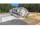 Aerial view of the property, showcasing the three-car garage and spacious driveway at 2925 Old Broadnax Mill Rd, Loganville, GA 30052