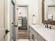 Stylish bathroom featuring a granite counter top and a view of a bunk room at 2925 Old Broadnax Mill Rd, Loganville, GA 30052