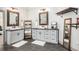 Bathroom with double vanity, modern fixtures, and ample storage in a neutral color palette at 2925 Old Broadnax Mill Rd, Loganville, GA 30052