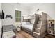 Cozy bedroom with custom-built bunk beds, wood floors, and a neutral color palette at 2925 Old Broadnax Mill Rd, Loganville, GA 30052