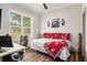 Bedroom featuring hardwood floors, natural light, and rustic wooden decor at 2925 Old Broadnax Mill Rd, Loganville, GA 30052